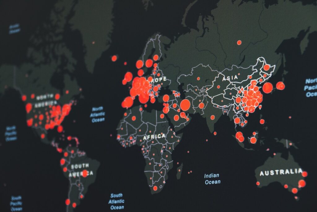 A world map showing COVID-19 cases in March 2020. Photo by Martin Sanchez on Unsplash