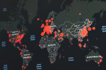 A world map showing COVID-19 cases in March 2020. Photo by Martin Sanchez on Unsplash